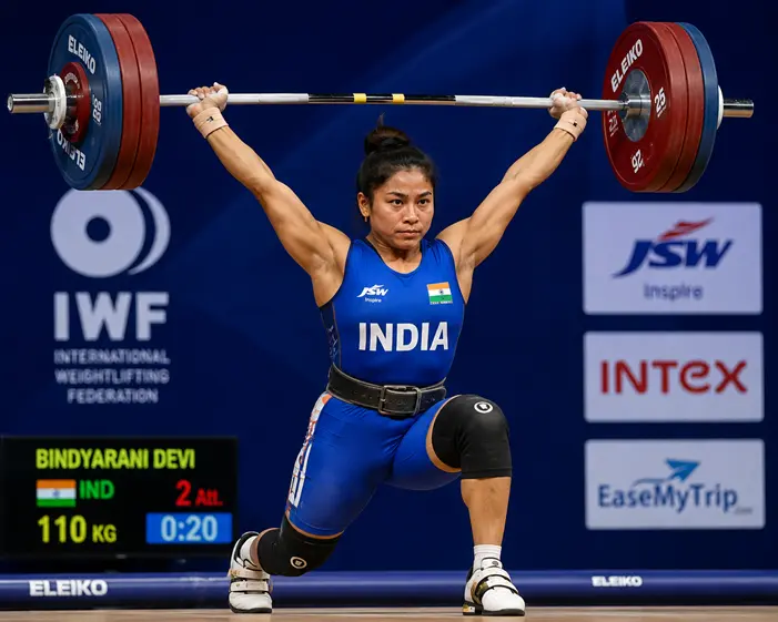 Bindyarani Devi Biography: Age, Weightlifting Career, Medals, Records, Commonwealth Games 2026 & More Bindyarani Devi performing a clean and jerk lift for India